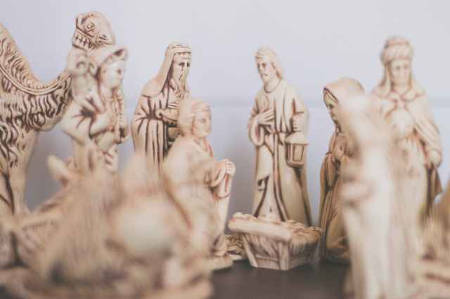 shallow focus photography of religious figurines